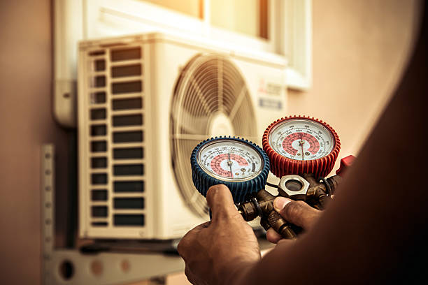 Professional Air Conditioning Service technician working in Exeter, RI